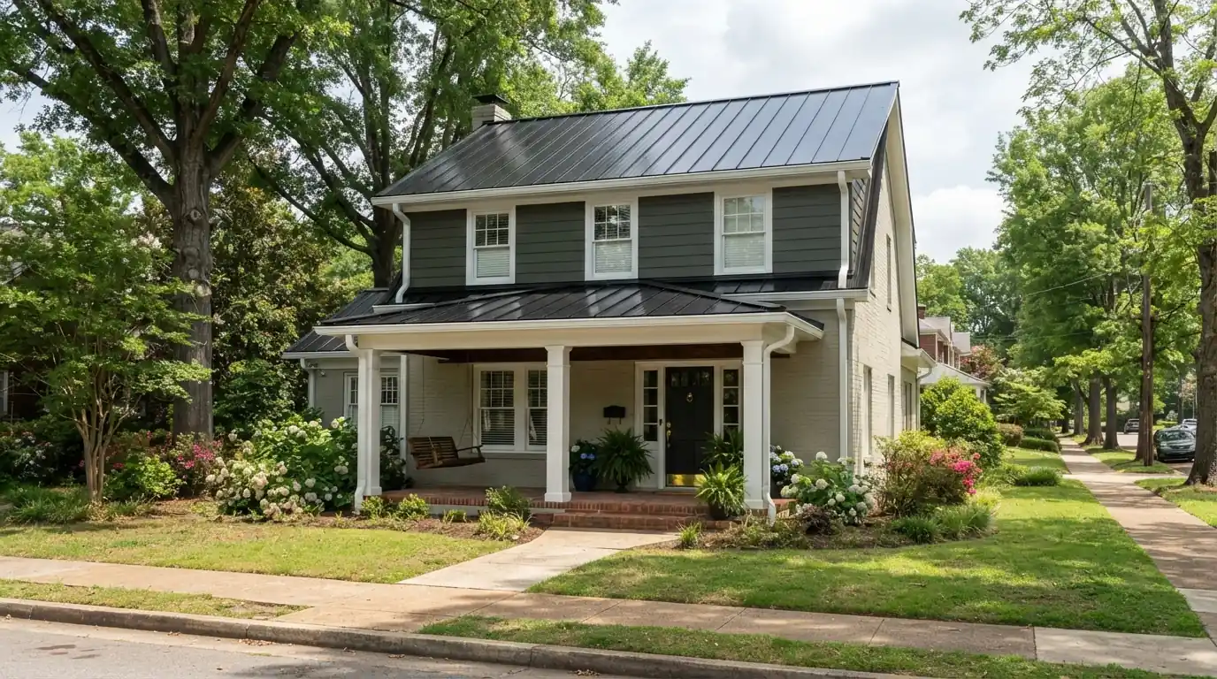 Black metal roof with new gutters on a two-story home